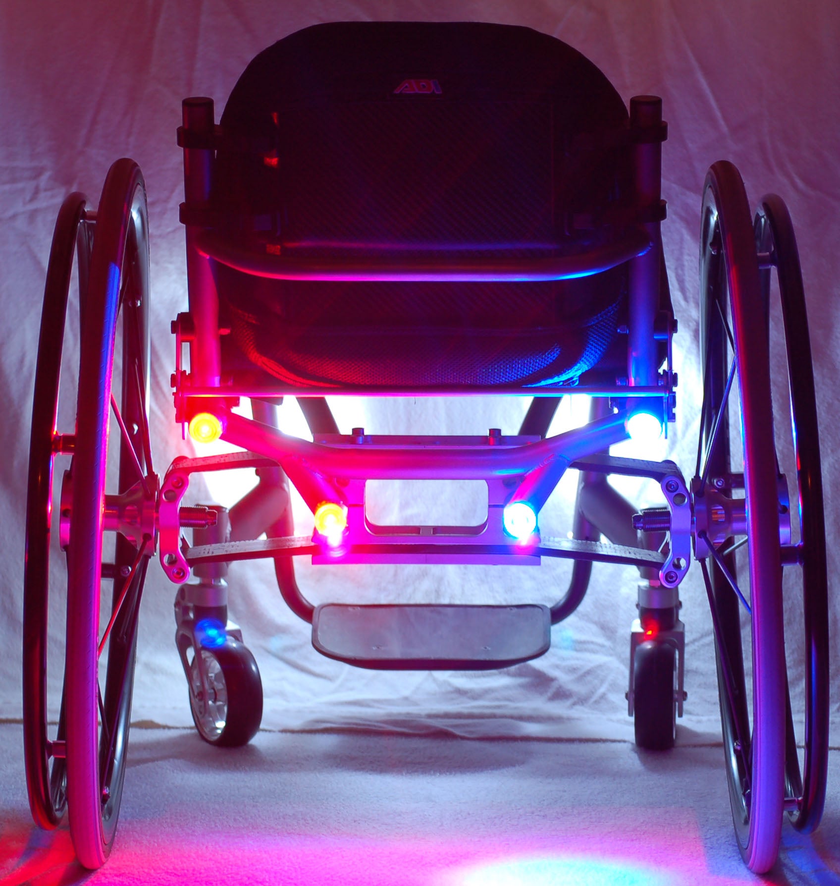 red and blue lights on the back of a wheelchair.